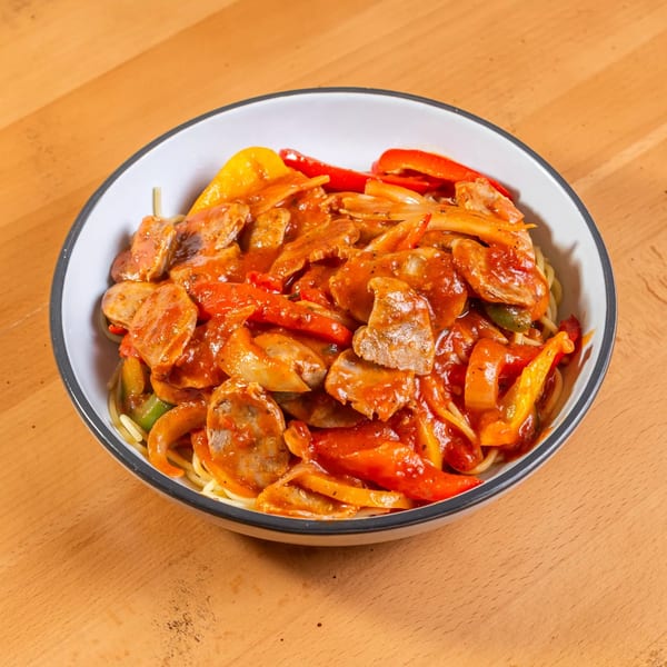 Rincon Italiano's pasta dish with sausage, red and yellow bell peppers, and tomato sauce.